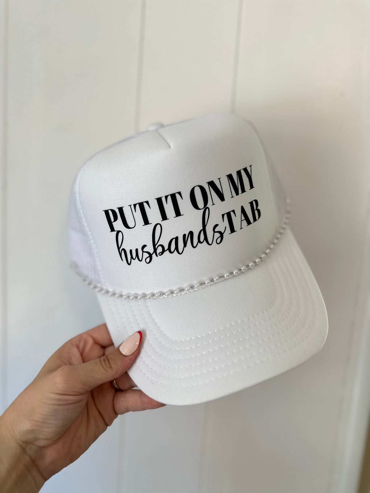 Put It on My Husband's Tab Trucker Hat